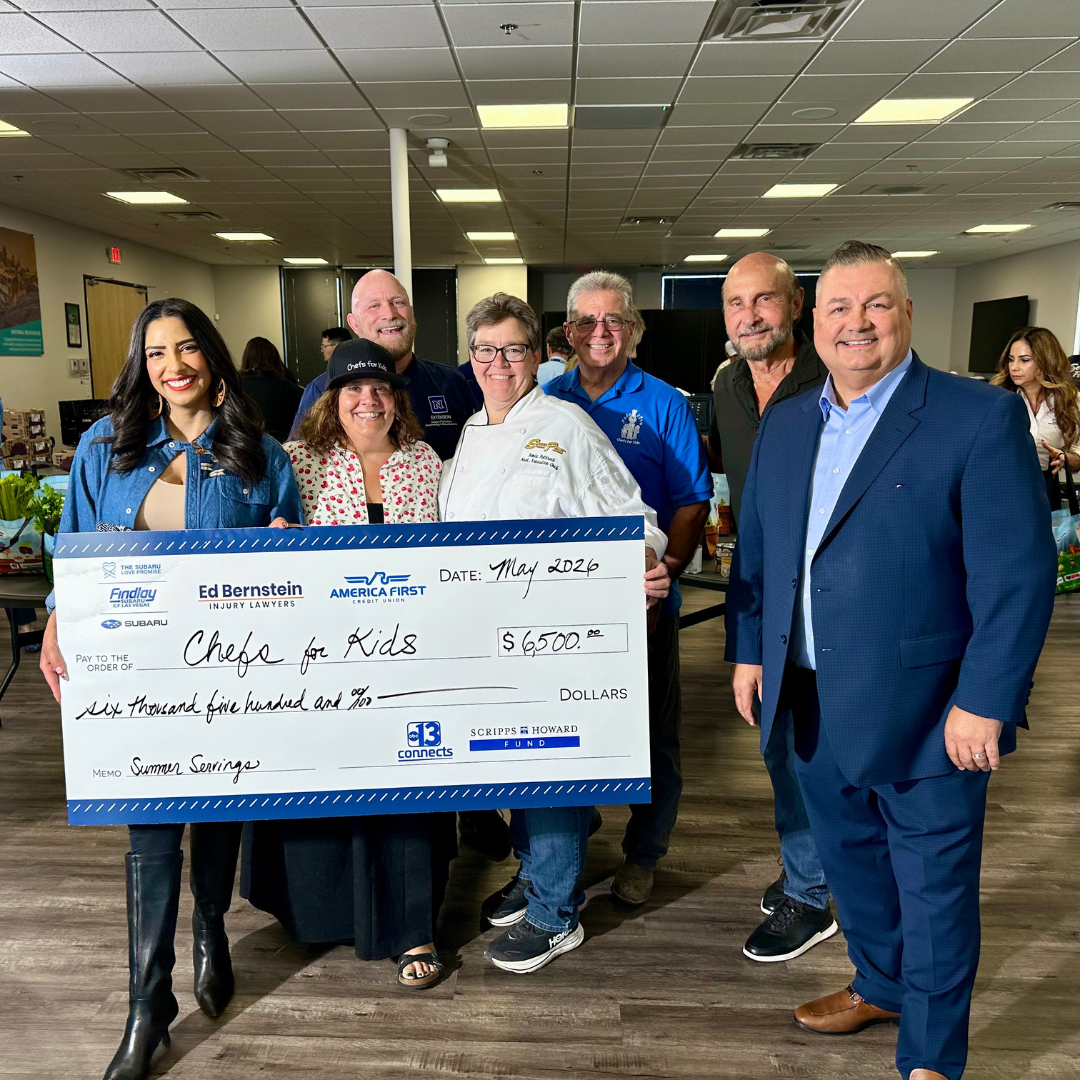 Ch. 13 presents a check to Chefs For Kids board members