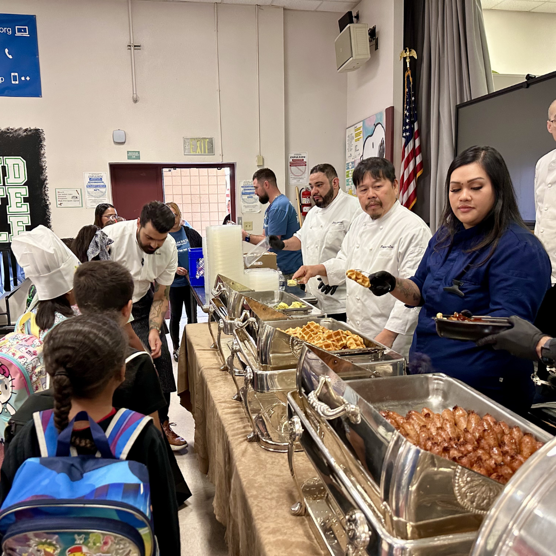 Chefs serve breakfast to students at Cahlan ES