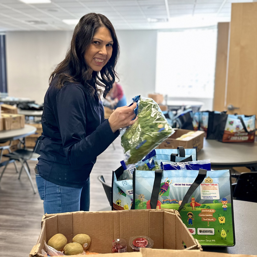 Plus Credit Union Employee Packing a Grocery Bag