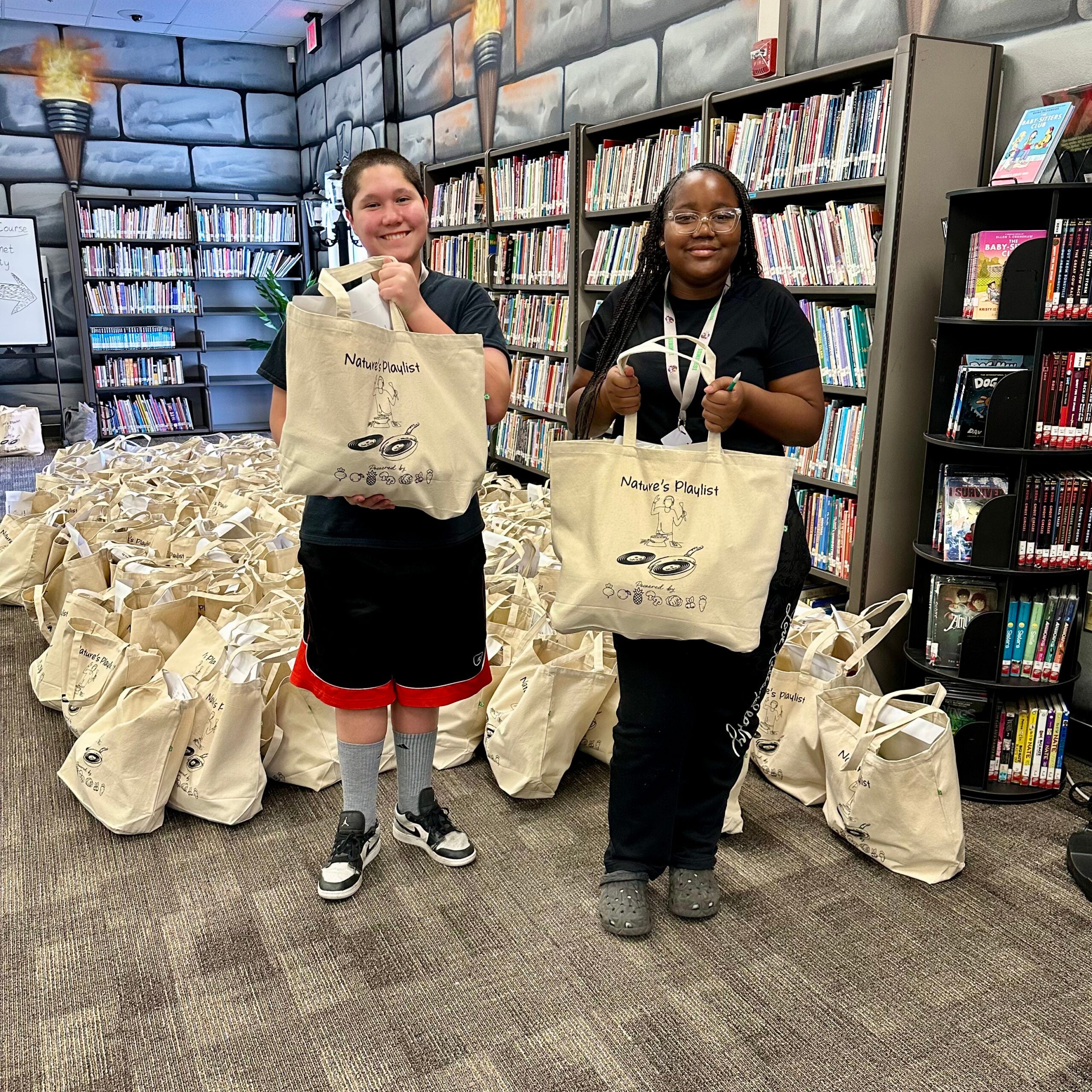 Students holding Nature's Playlist Bag
