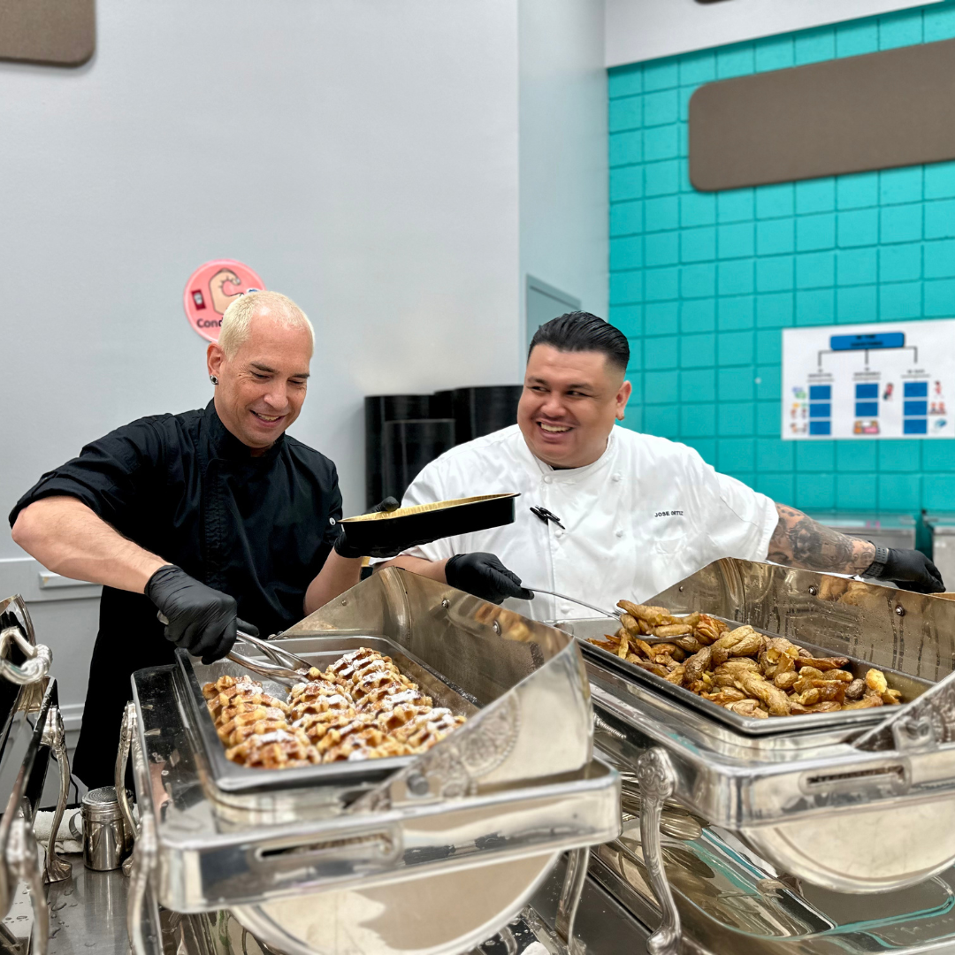 Two male MGM chefs prepare breakfast