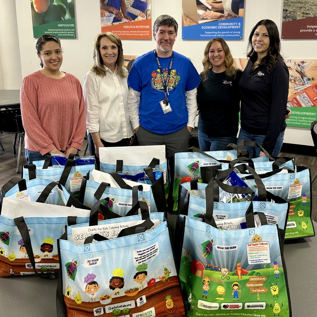 Volunteers Stand in Front of Food Bags Packed at Holiday Helpings